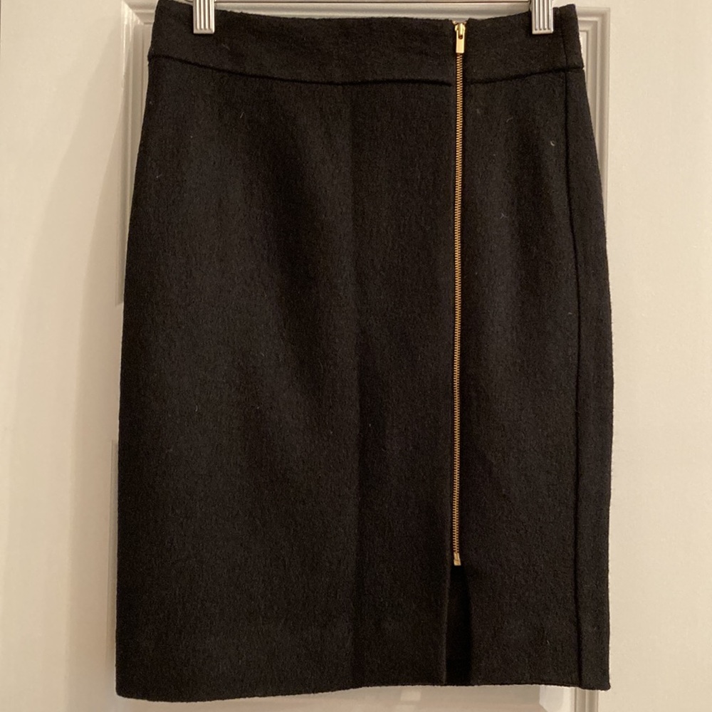 Banana Republic size 0P black lined with bold gold zipper style.